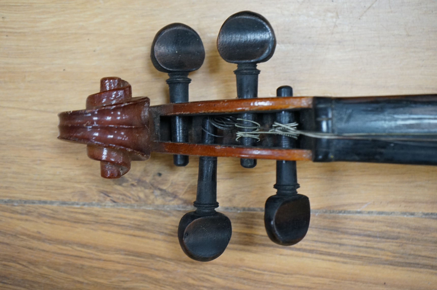 An early 20th century violin, possibly Czech, with internal label for ‘Maidstone Orchestra Association, Oxford St. London’ and bow, in case, length of back of body, 36cm., Condition - fair to good.